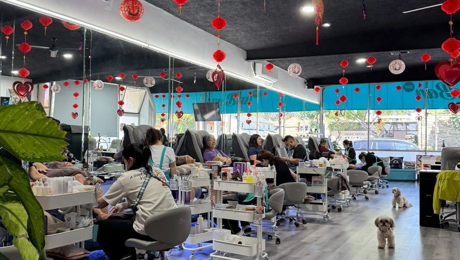 Inside BeautyBar SGV in San Gabriel, California, US, patrons enjoy nail services amid vibrant decor.