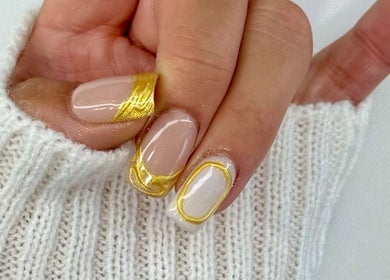 Elegant nail art with gold accents at BeautyBar SGV, San Gabriel, California, US.