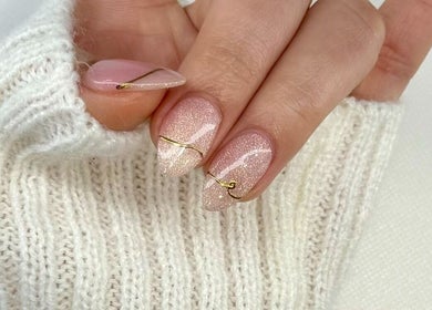 Elegant sparkling nude nails with gold accents at BeautyBar SGV in San Gabriel, California, US.