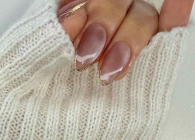 Elegant manicure with gold accents at BeautyBar SGV, San Gabriel, California, US.