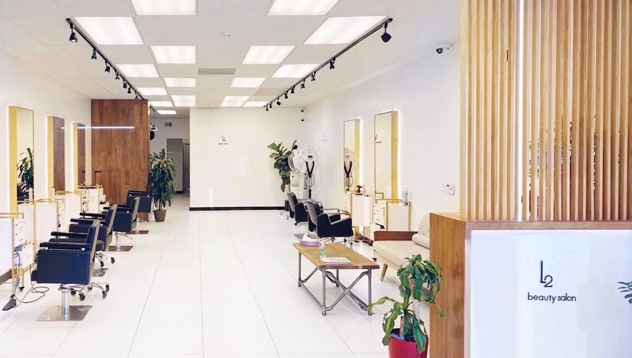 Modern interior of L2 hair salon in Millbrae, California, US with stylish decor and sleek salon chairs.
