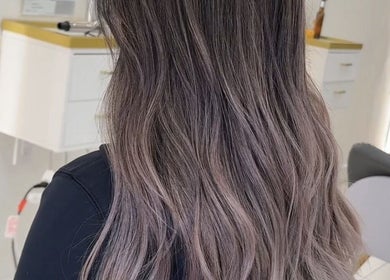 Elegant wavy hairstyle at L2 hair salon, Millbrae, California, US, showcasing beautiful color and texture.