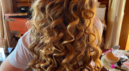 Stylish blonde curls showcased at Style Journey Hair Salon, Pretoria, Gauteng, ZA.