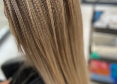 Beautifully styled blonde hair at Style Journey Hair Salon, Pretoria, Gauteng, ZA showcasing sleek shine.