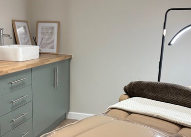 Peaceful treatment room at Miceli Beauty Studio, Waterlooville, England, GB featuring a cozy bed and sink.