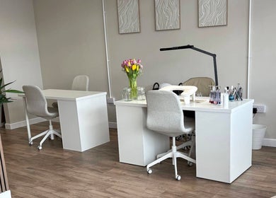 Bright nail studio at Miceli Beauty Studio, Waterlooville, England with modern decor and tulip flowers.