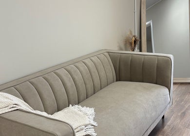 Elegant beige sofa at Miceli Beauty Studio, Waterlooville, England for comfort and style.