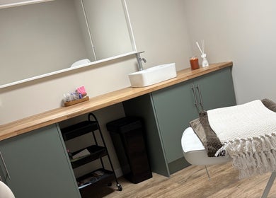 Serene treatment room at Miceli Beauty Studio, Waterlooville, England, featuring a cozy massage table.