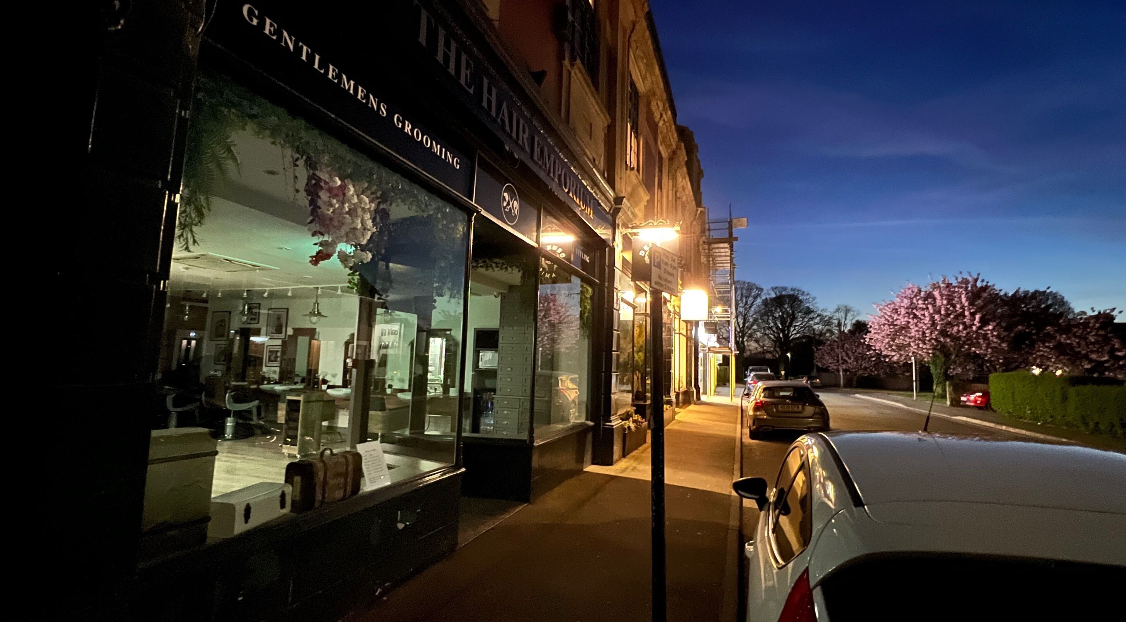 The Hair Emporium (Whalley) at dusk, showcasing its elegant interior in Whalley, England, GB.