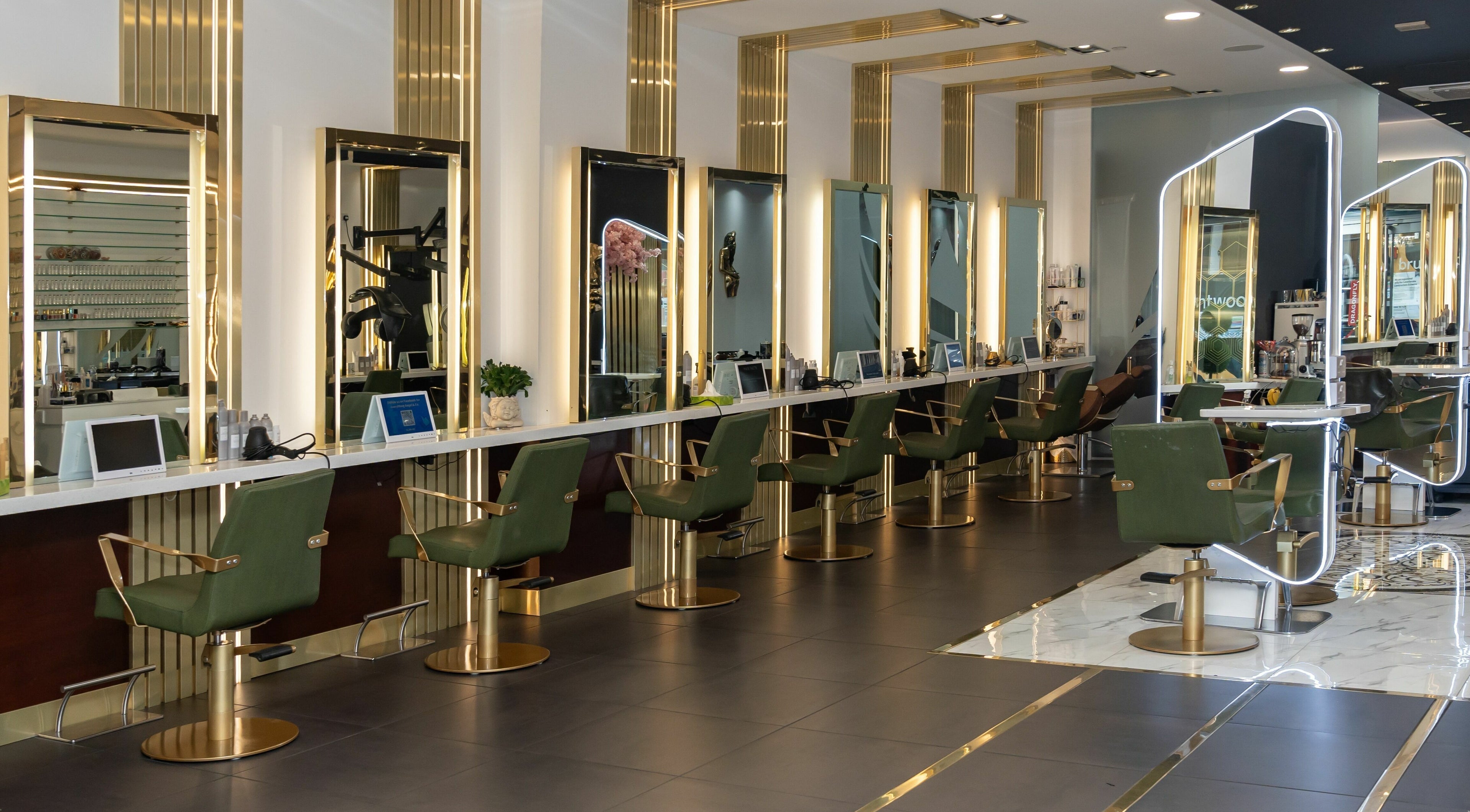 Elegant interior of Angel & Co. salon with stylish chairs in Manchester, England, GB.