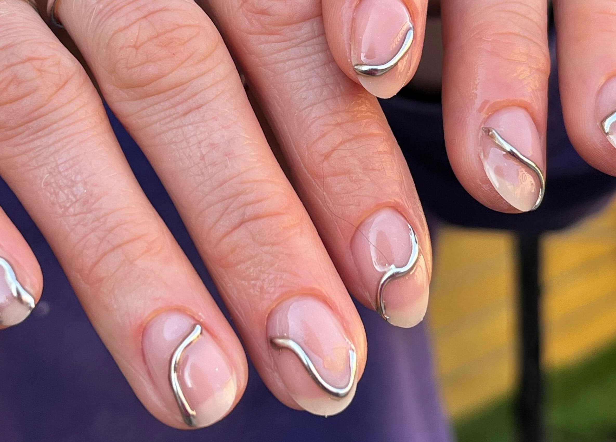 Elegant chrome nails art at Claws By Clayre in Glasgow, Scotland, GB.