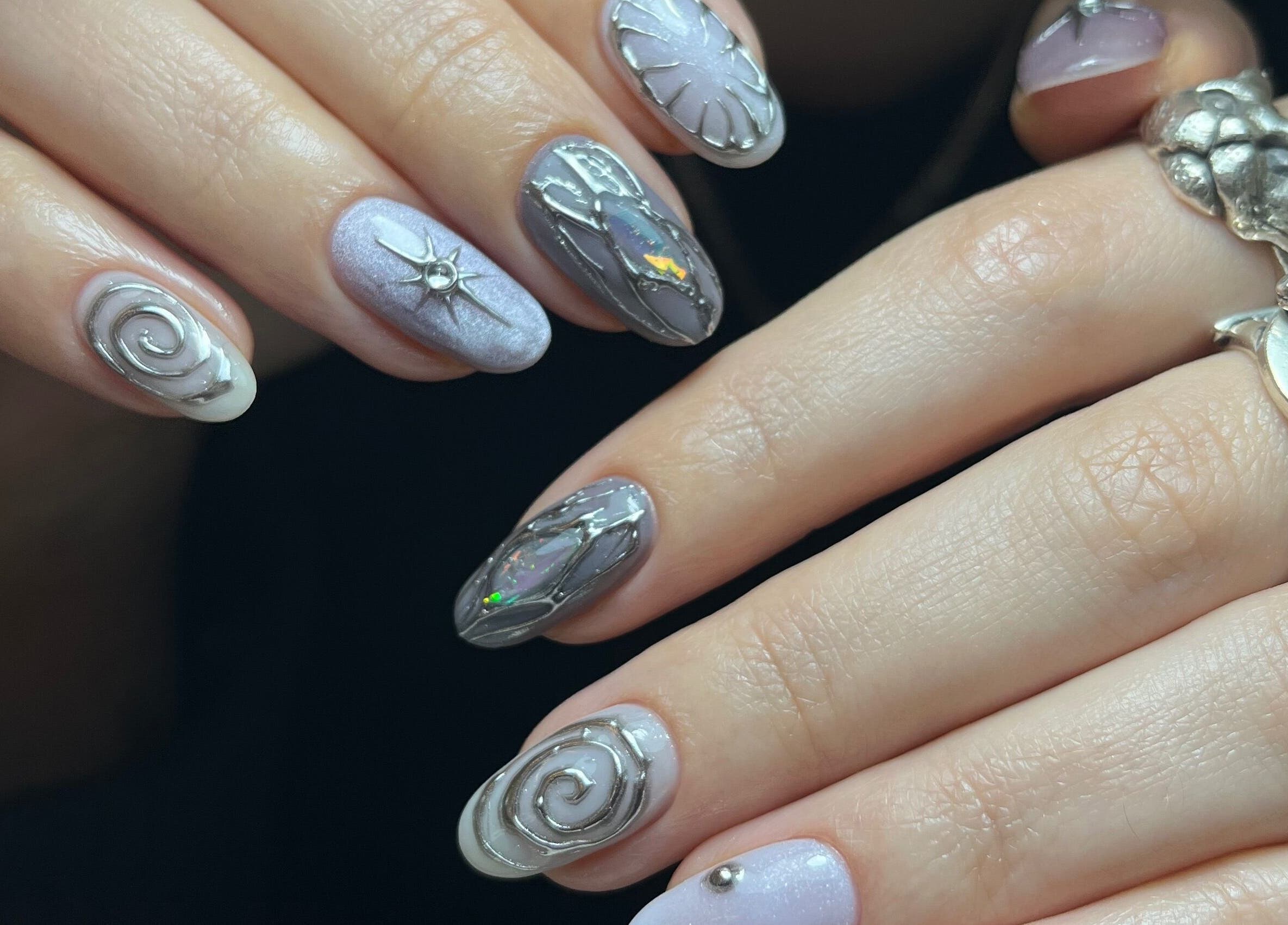 Intricate spiral nail art at Claws By Clayre, Glasgow, Scotland, GB showcasing artistic flair.