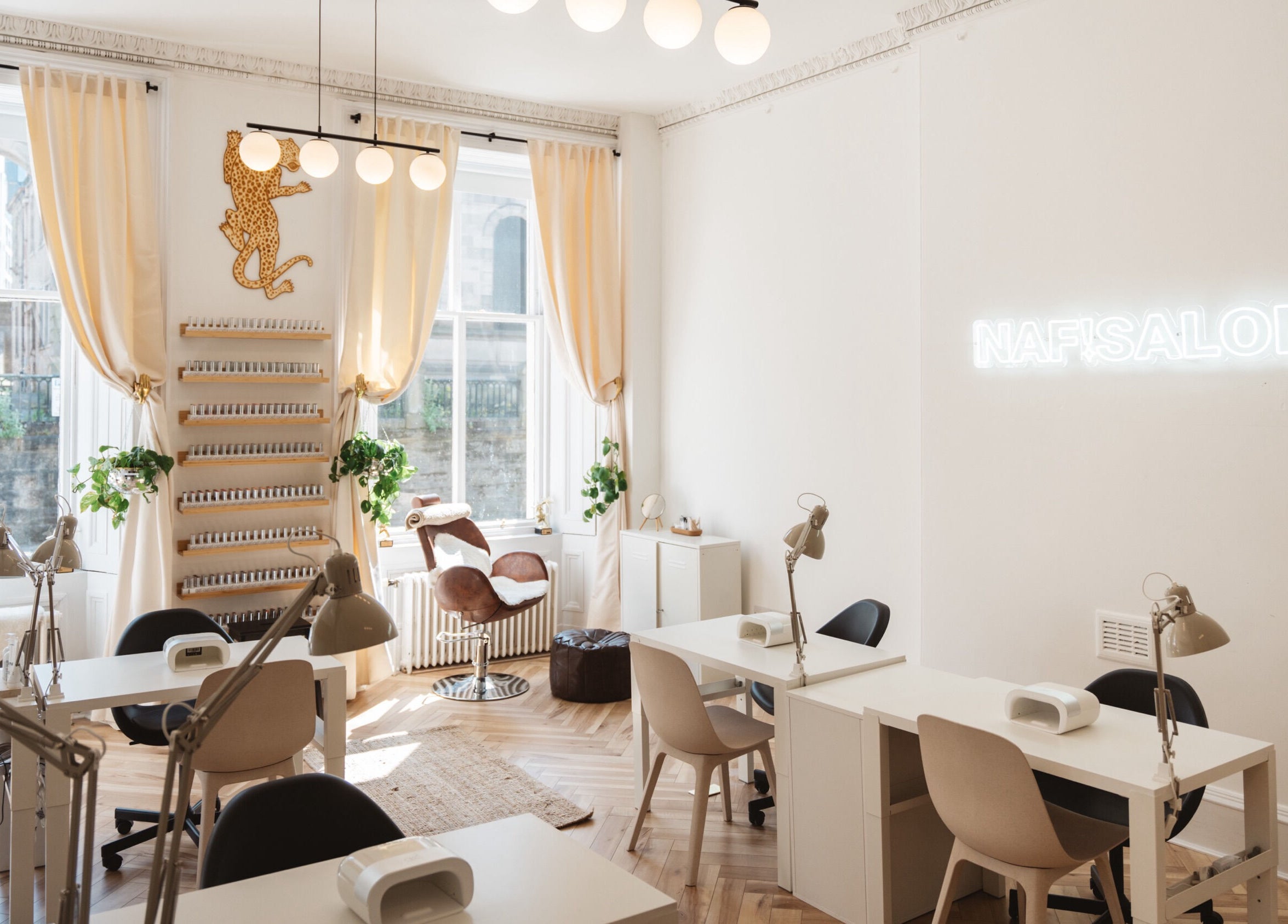 Modern nail salon interior at Claws By Clayre in Glasgow, Scotland, GB, featuring chic decor and natural light.