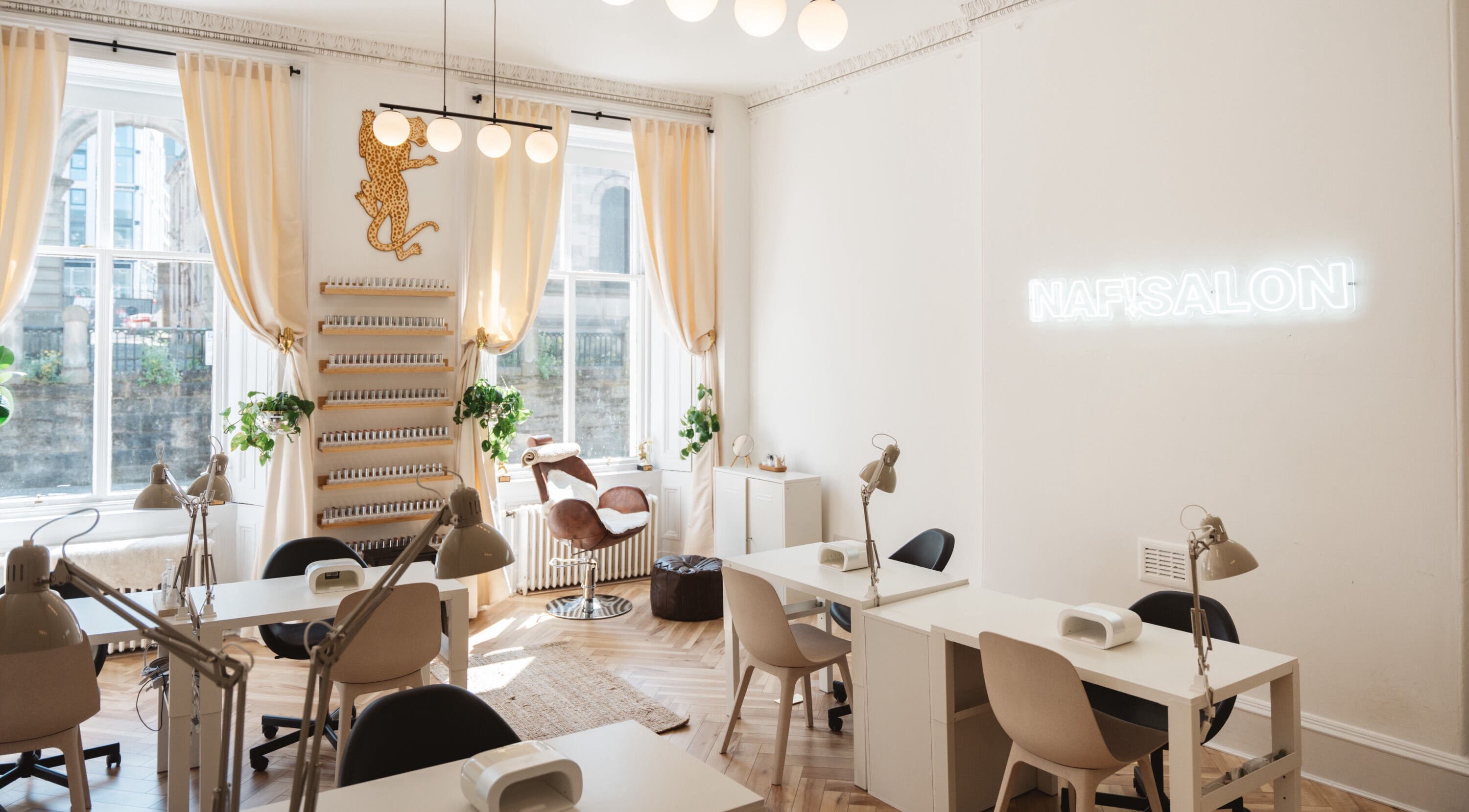 Modern nail salon interior at Claws By Clayre in Glasgow, Scotland, GB, featuring chic decor and natural light.