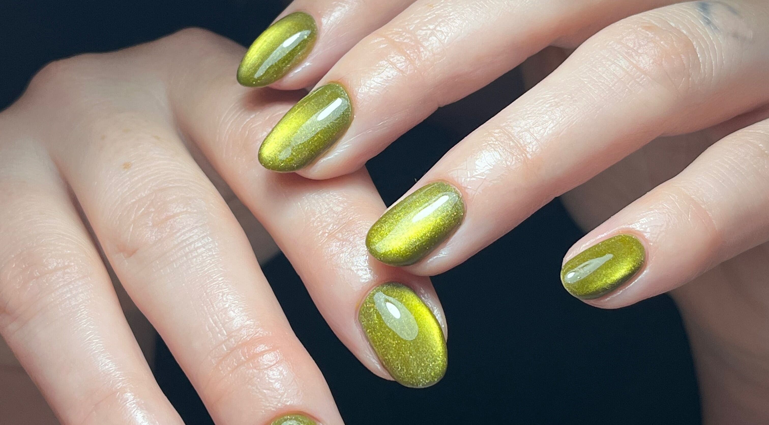 Stunning green gel manicure at Claws By Clayre, Glasgow, Scotland, GB showcasing glossy, perfectly shaped nails.