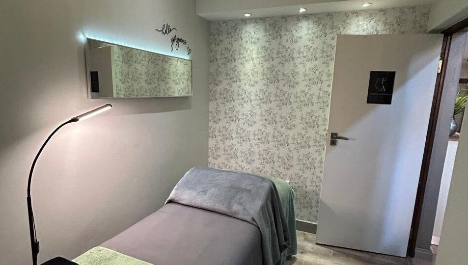 Relaxing treatment room at Faithful Aesthetics, Pretoria, Gauteng, ZA, with cozy bed and soft lighting.