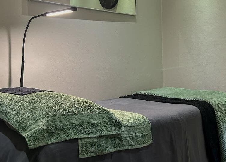 Peaceful treatment room at Faithful Aesthetics, Pretoria, Gauteng, ZA, featuring a comfortable massage table.