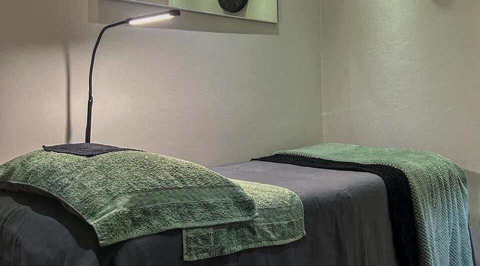 Peaceful treatment room at Faithful Aesthetics, Pretoria, Gauteng, ZA, featuring a comfortable massage table.