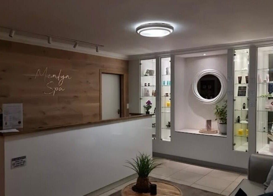 Elegant lobby of Faithful Aesthetics, Pretoria, Gauteng, ZA with modern decor and display shelves.