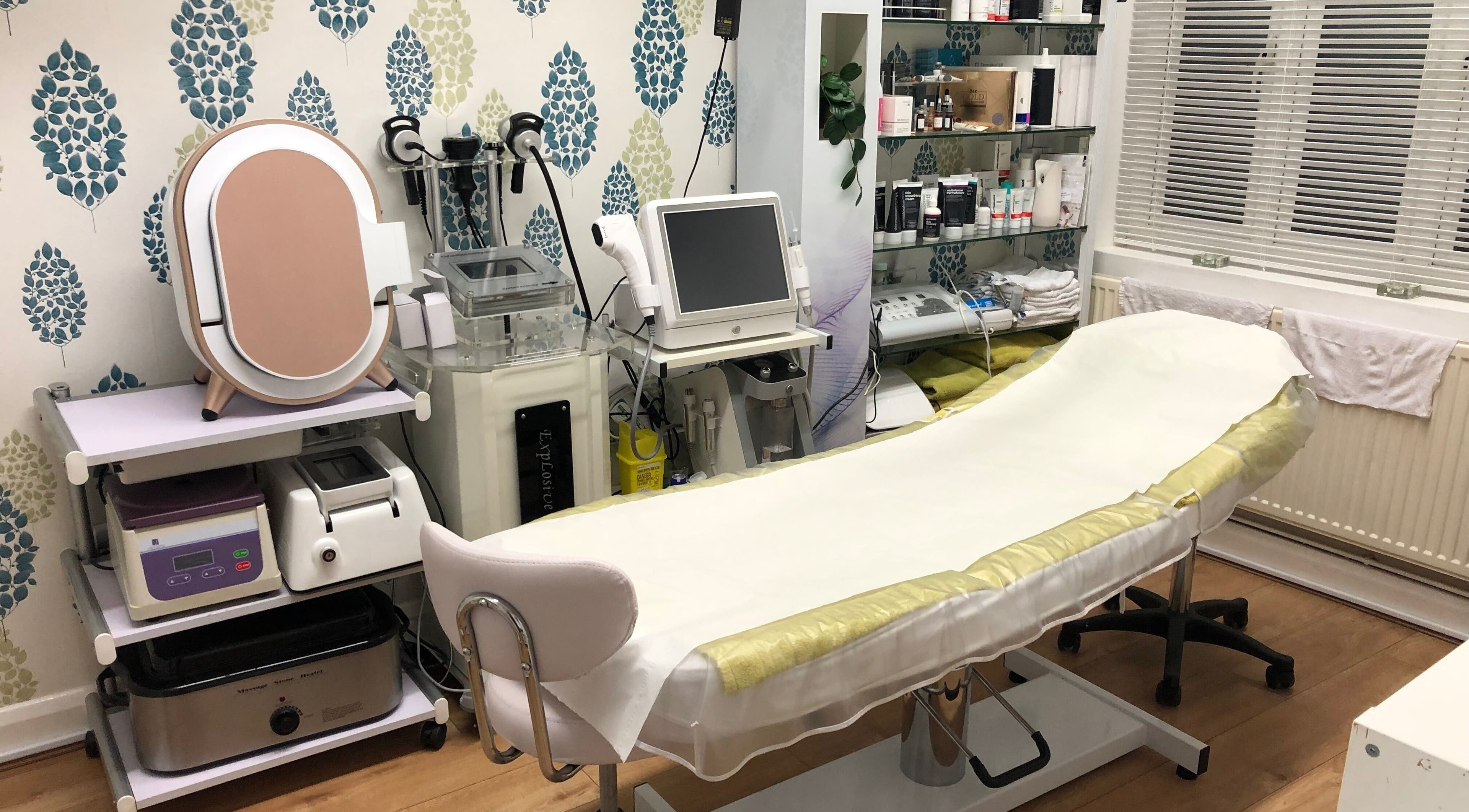 Modern beauty treatment room at Real Beauty in Hampton, England, GB with advanced equipment and soothing decor.