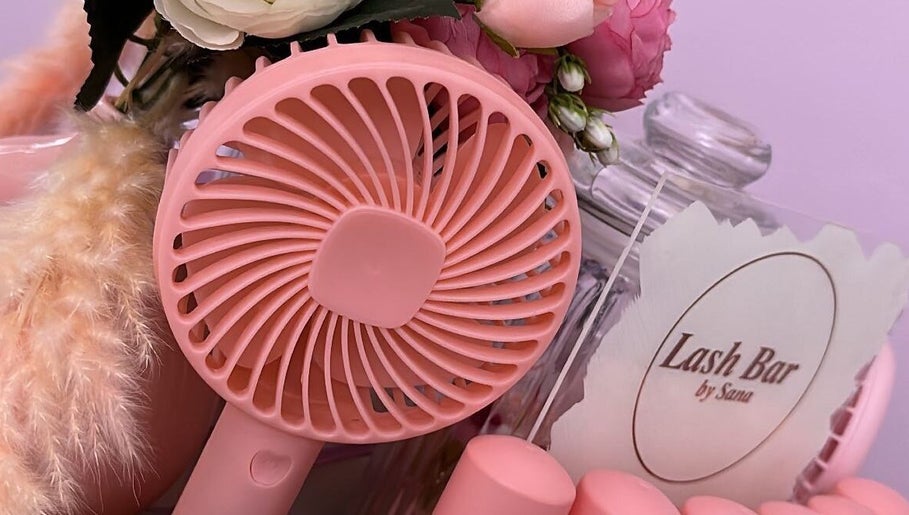 Stylish pink display at Lash Bar by ST, Birmingham, England, GB with fan and flowers.