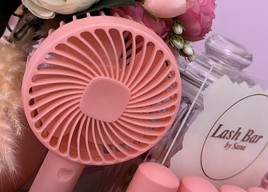 Stylish pink display at Lash Bar by ST, Birmingham, England, GB with fan and flowers.