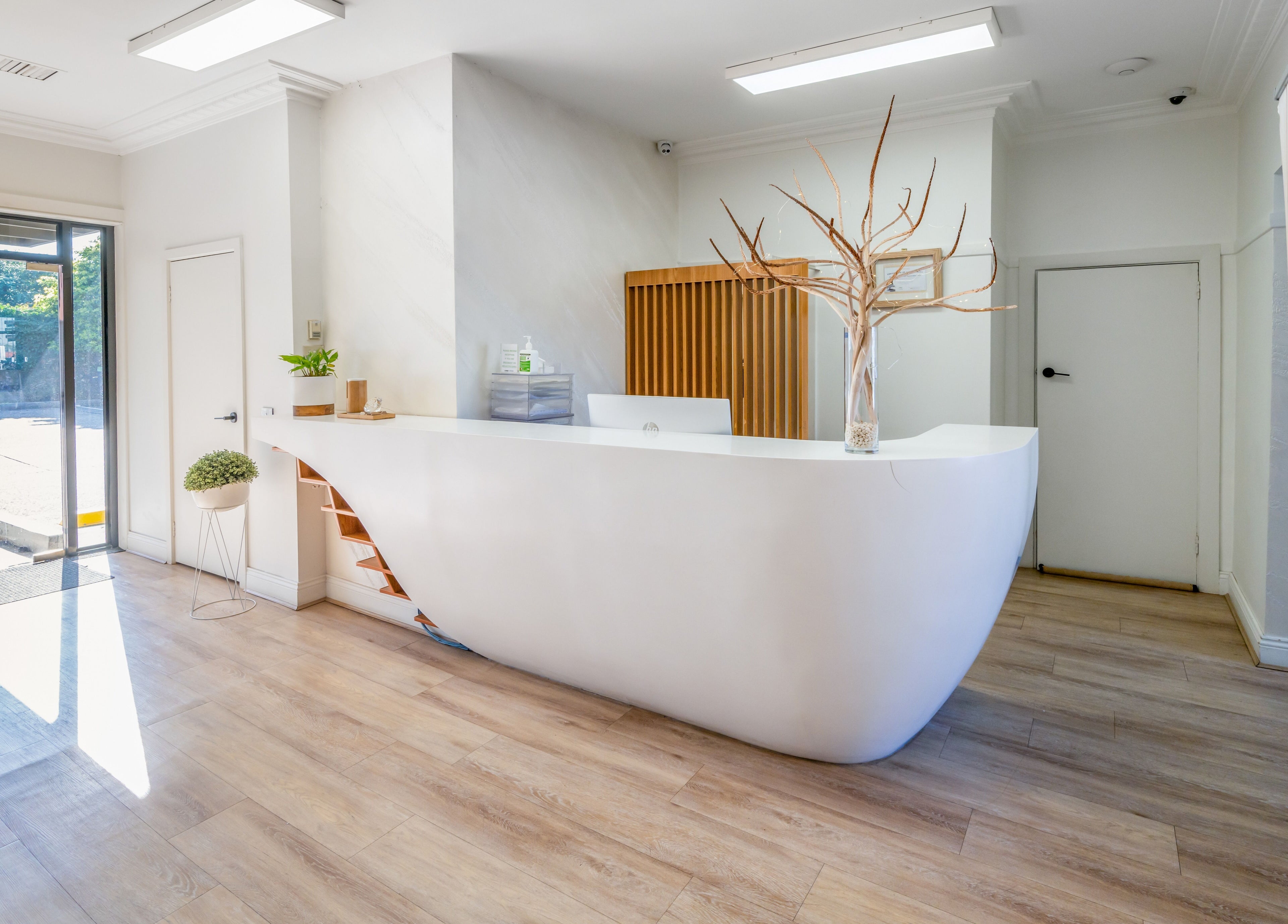 Elegant reception area of My Skinic, Melbourne, Victoria, AU featuring modern decor and bright natural light.