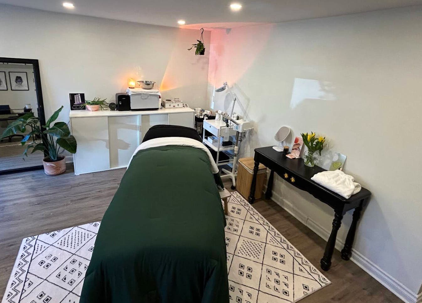 Elegant treatment room at Glow Studio Skin & Beauty, Hamilton, Ontario, CA with a massage table and decor.