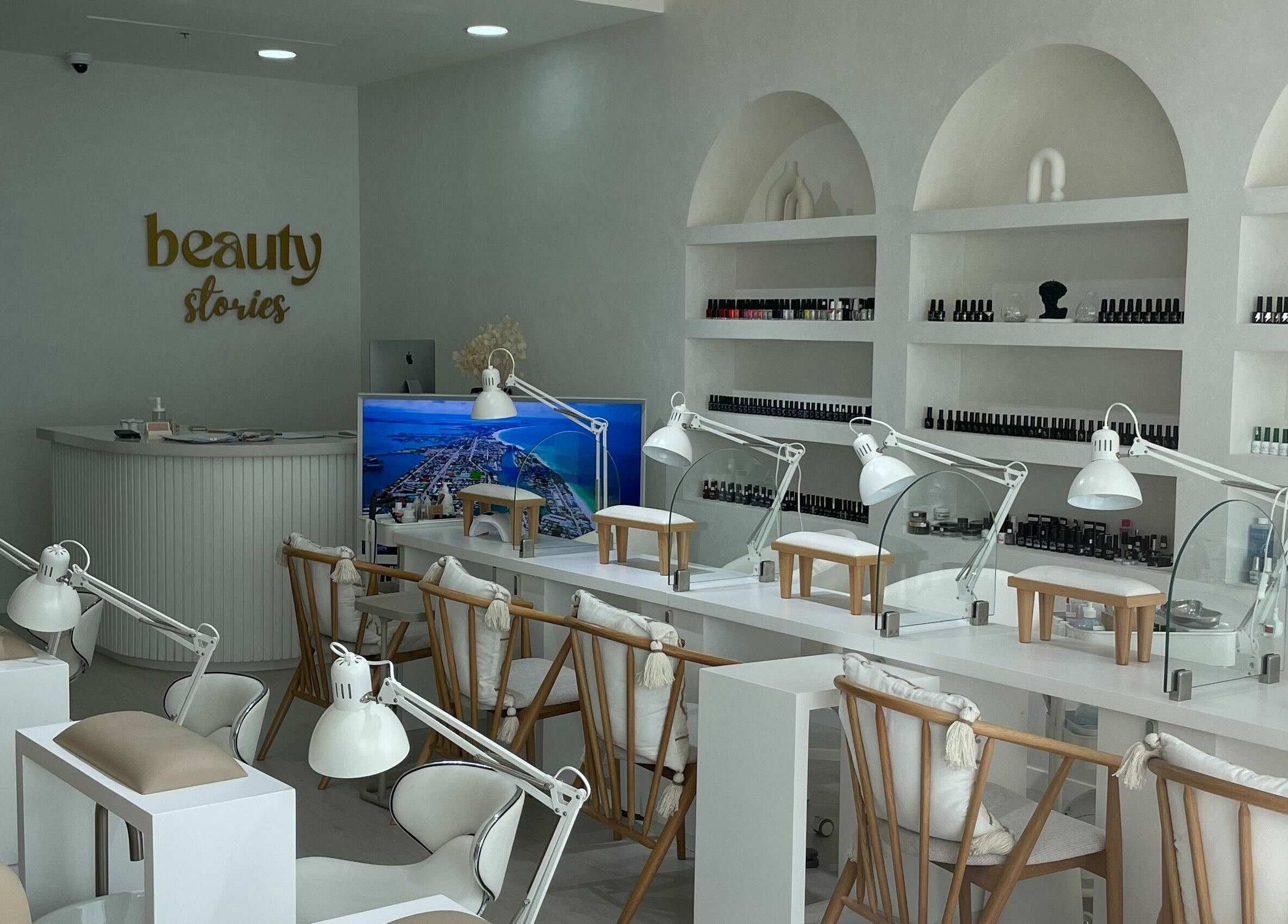 Elegant nail station at Beauty Stories Dmcc, Dubai, Dubai, AE featuring modern decor and cozy seating.