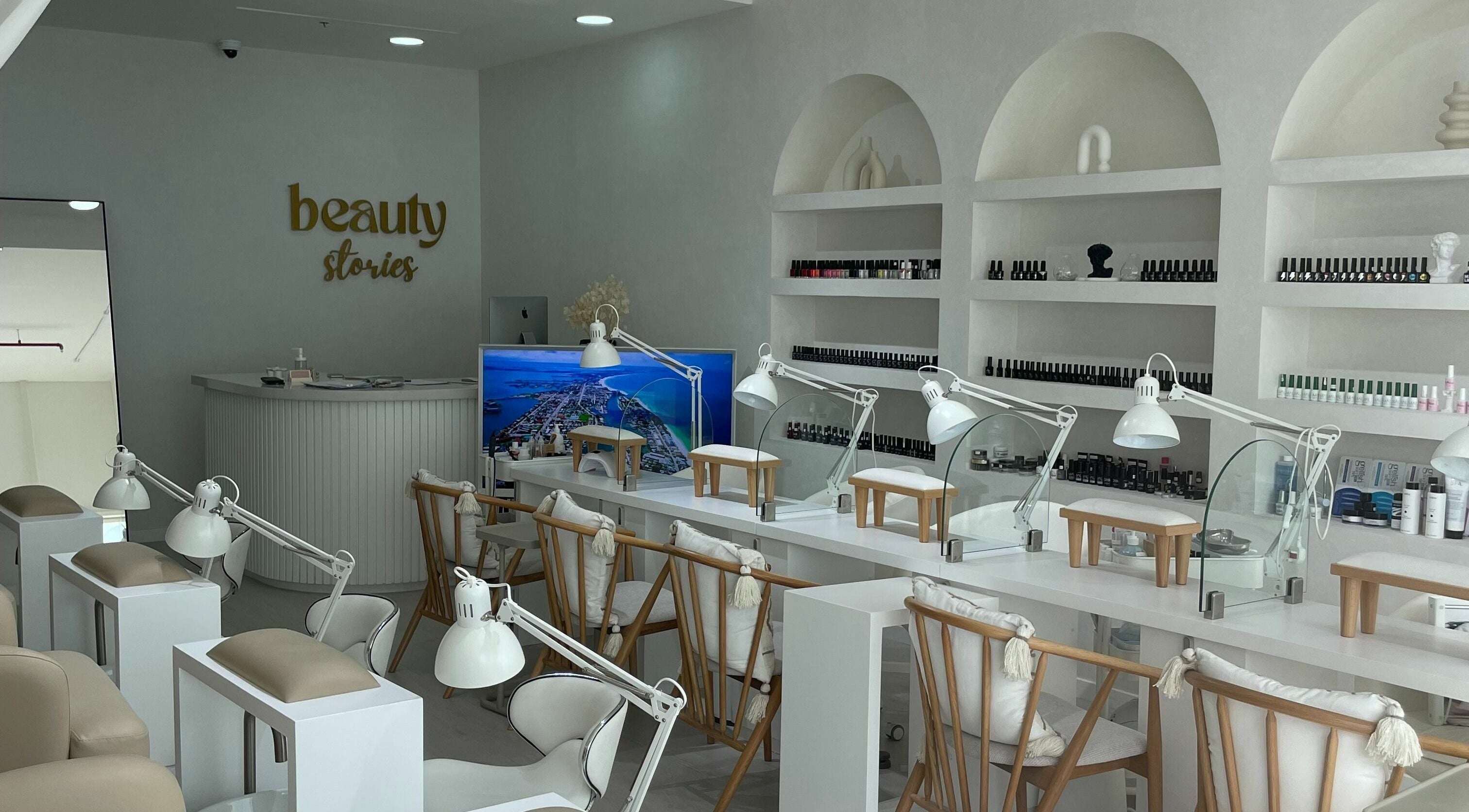 Elegant nail station at Beauty Stories Dmcc, Dubai, Dubai, AE featuring modern decor and cozy seating.