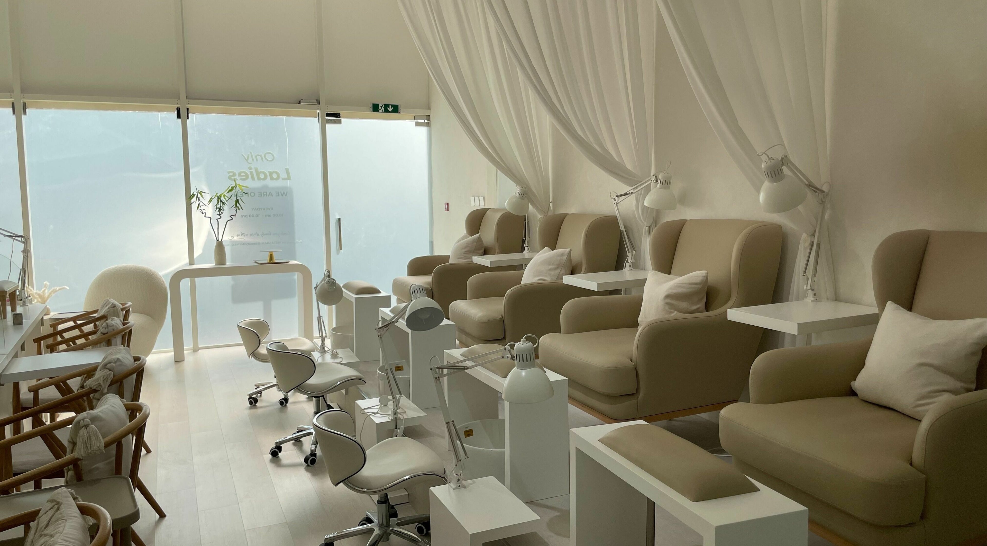 Elegant nail spa interior at Beauty Stories Dmcc, Dubai, Dubai, AE, featuring plush chairs and soft lighting.