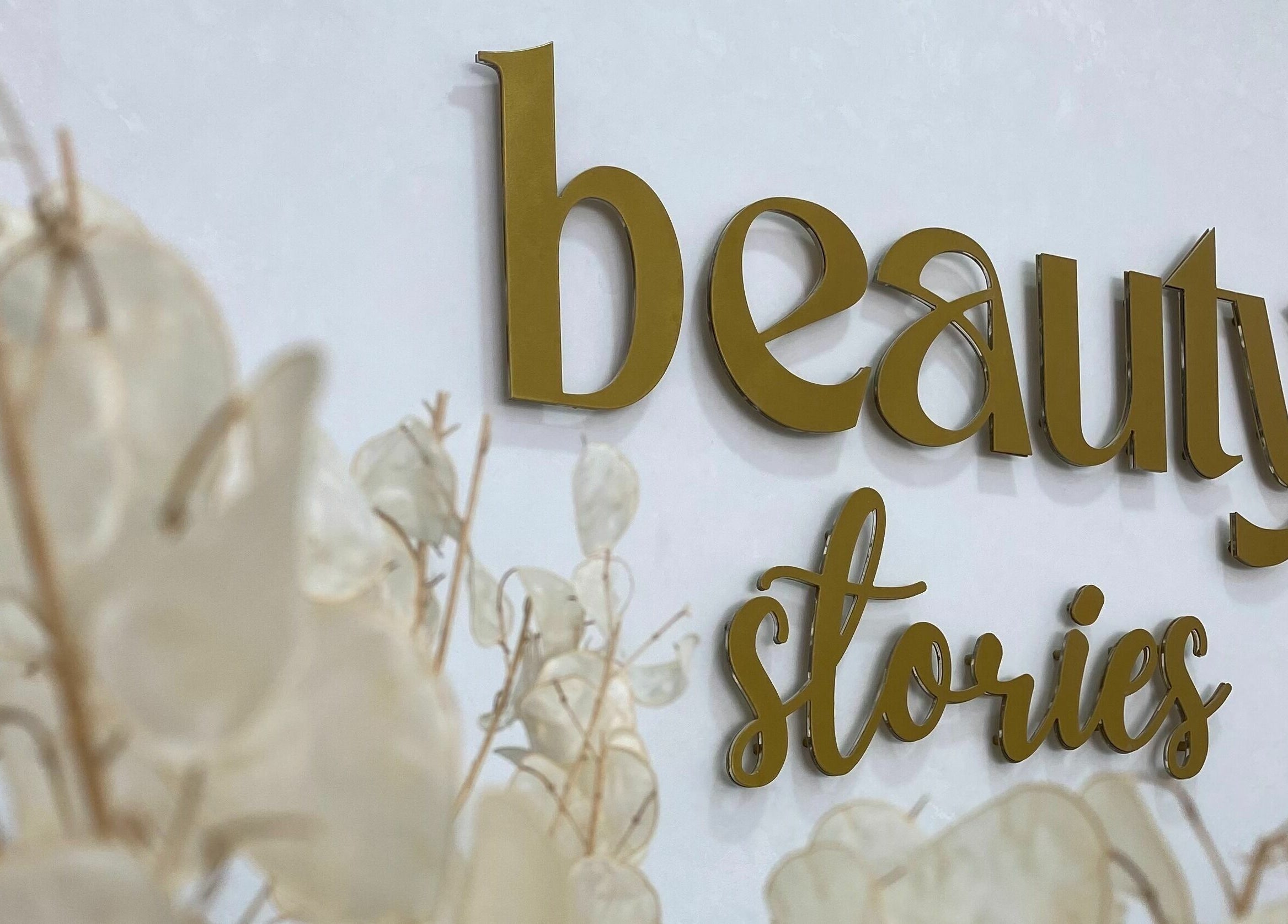 Beauty Stories Dmcc signage with floral decor, Dubai, Dubai, AE.