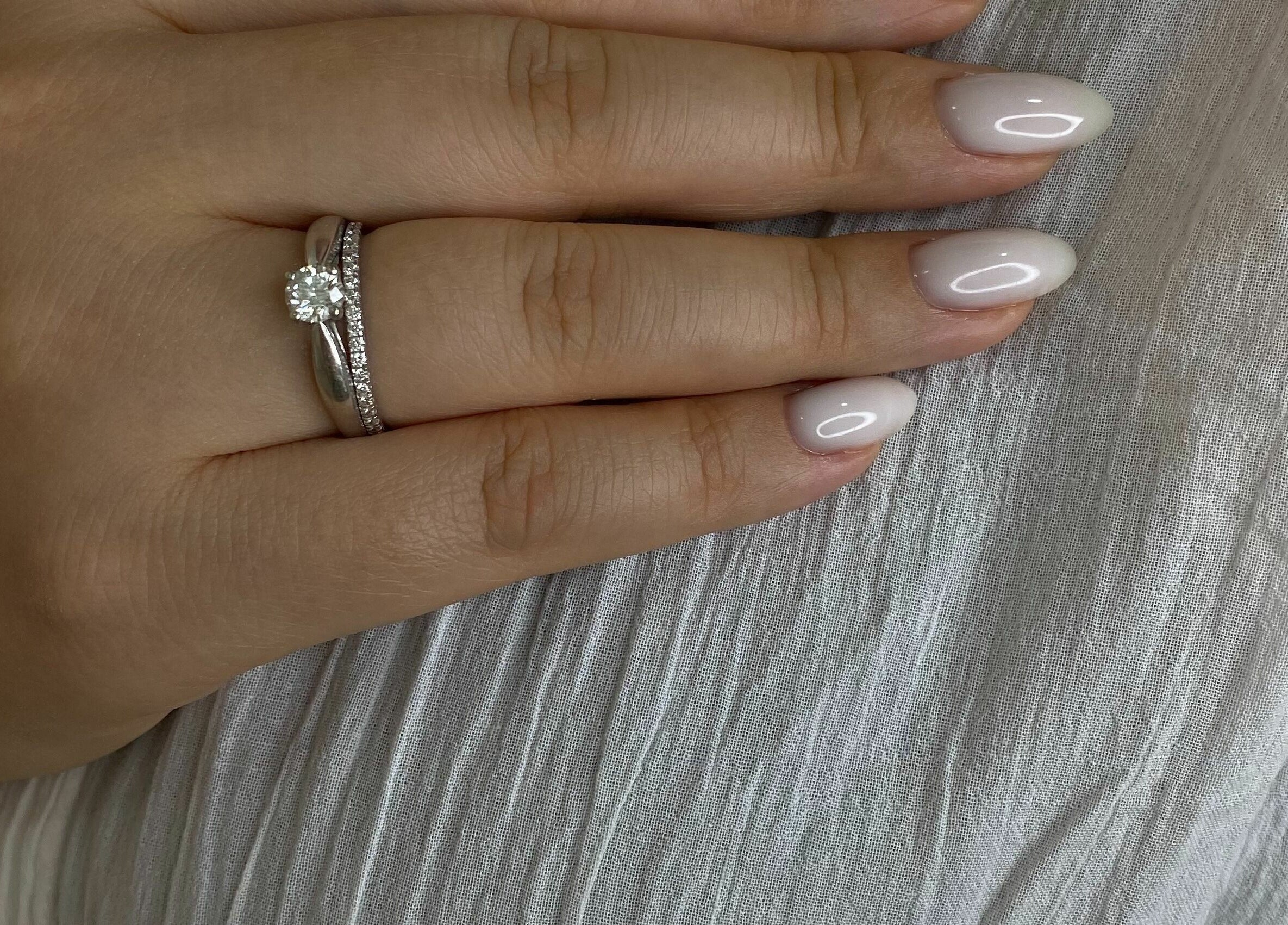 Elegant manicured nails with a diamond ring at Beauty Stories Dmcc, Dubai, Dubai, AE.