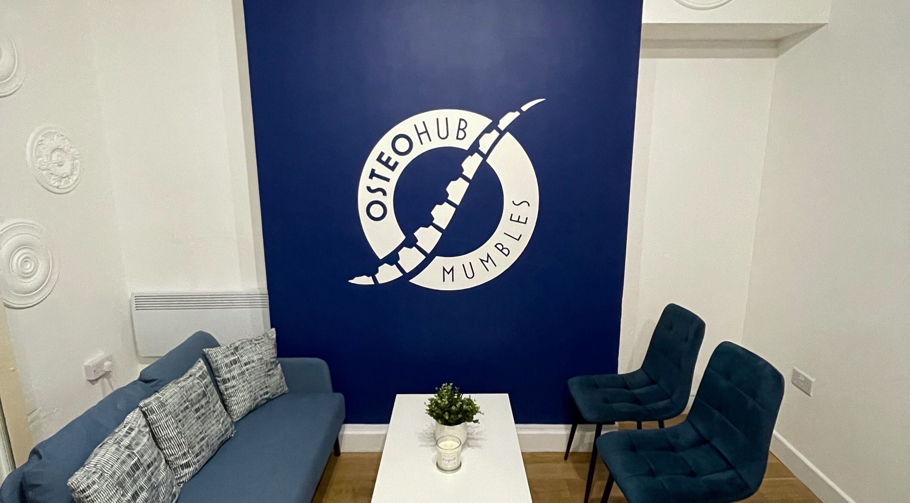 Comfortable seating area at OsteoHub Mumbles in Swansea, Wales, GB with blue decor and modern accents.