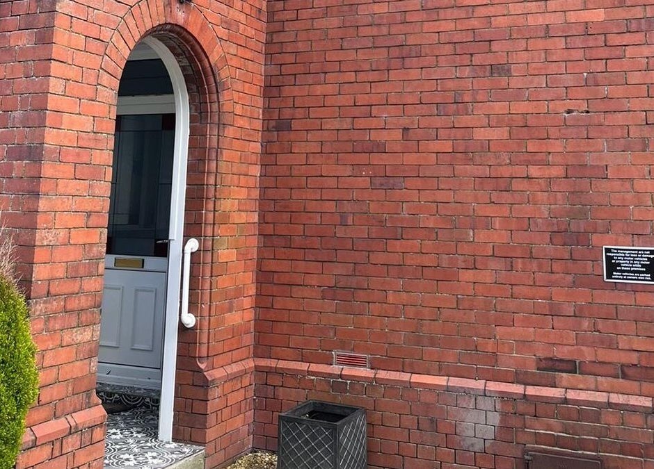 Entrance with brick archway at Oaktree Parc Clinic, Birchgrove, Wales, GB.