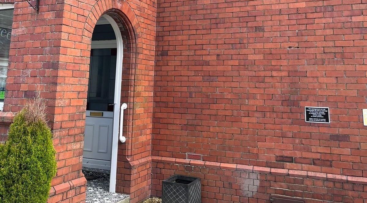 Entrance with brick archway at Oaktree Parc Clinic, Birchgrove, Wales, GB.
