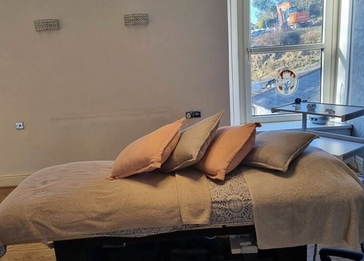 Cozy treatment room at Oaktree Parc Clinic, Birchgrove, Wales, GB with inviting massage bed and relaxing ambiance.