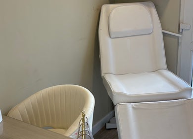 Relaxing nail station at Charlotte Marie Nails And Beauty, Heysham, England, GB, featuring a cozy white chair.