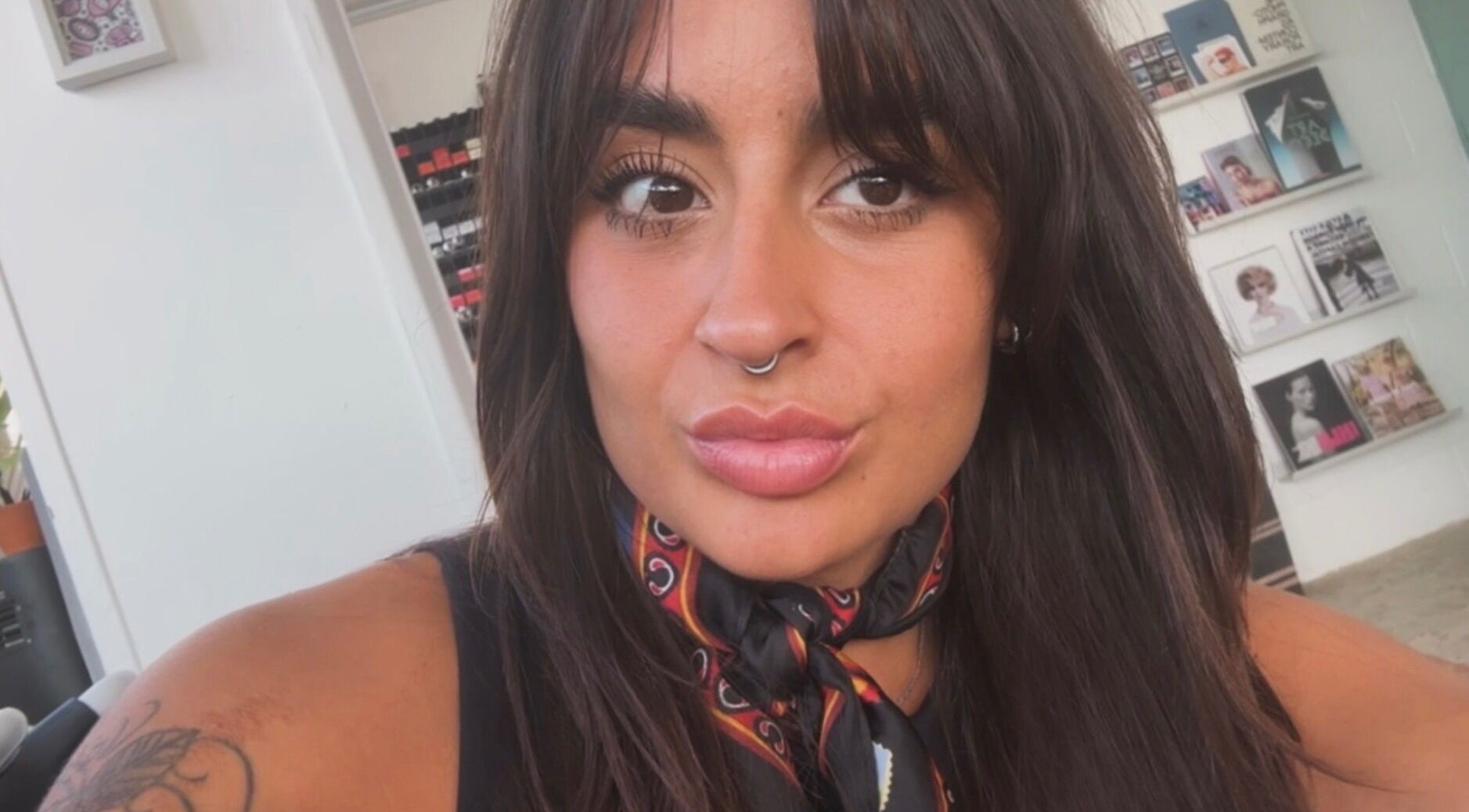 Client at Amanda Borges hairstylist studio in London, England, GB, showcasing elegant hair and welcoming ambiance.