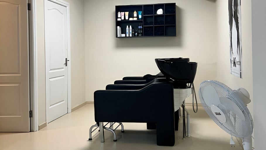 Mademoiselle Hair and Beauty wash stations in Cape Town, Western Cape, ZA with modern black chairs.