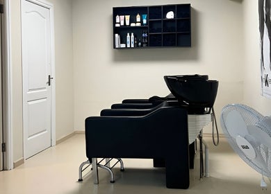 Mademoiselle Hair and Beauty wash stations in Cape Town, Western Cape, ZA with modern black chairs.