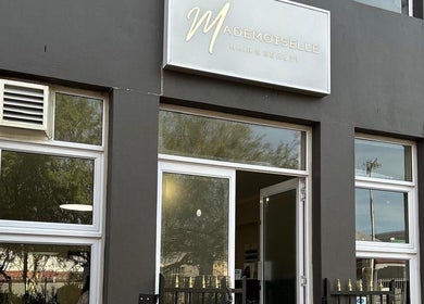 Entrance of Mademoiselle Hair and Beauty, Cape Town, Western Cape, ZA with a sleek modern design.