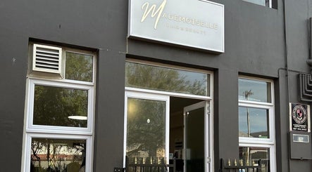 Entrance of Mademoiselle Hair and Beauty, Cape Town, Western Cape, ZA with a sleek modern design.