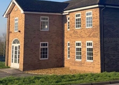 Exterior of Masee Rose Hair, a charming brick building in Manchester, England, GB.