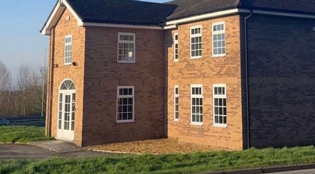 Exterior of Masee Rose Hair, a charming brick building in Manchester, England, GB.