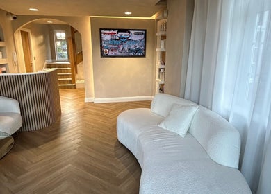 Stylish interior of Masee Rose Hair, Manchester, England, GB, featuring a cozy seating area and modern decor.