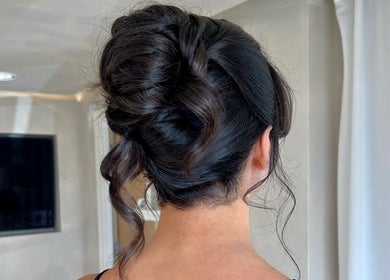 Sophisticated updo hairstyle at Masee Rose Hair in Manchester, England, GB, showcasing expert hair styling.