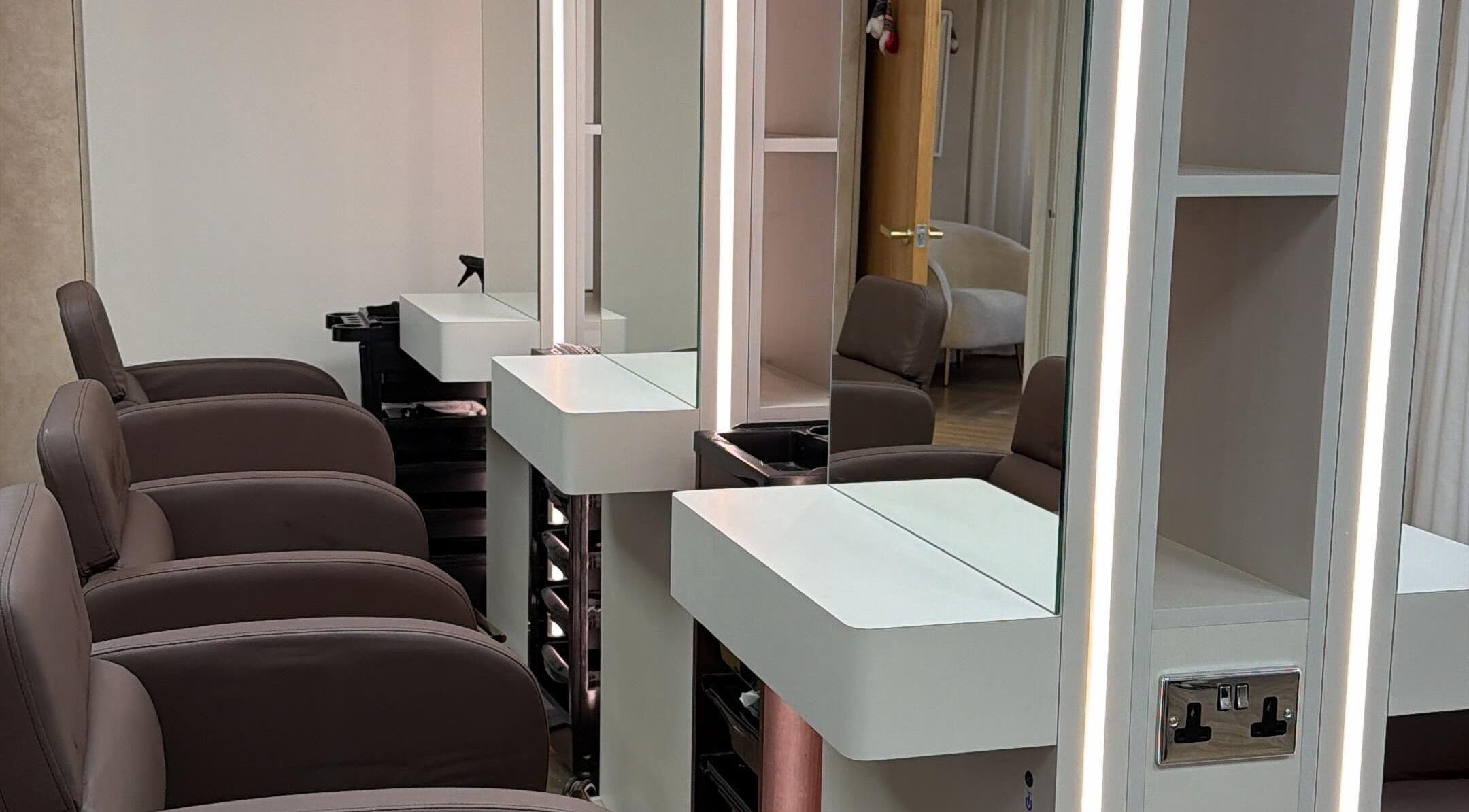 Elegant salon chairs and mirrors at Masee Rose Hair, Manchester, England, GB.