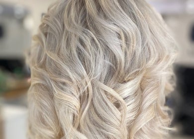 Blonde wavy hairstyle at Me and You Hair Salon in Corrimal, New South Wales, AU, showcasing fine texture.