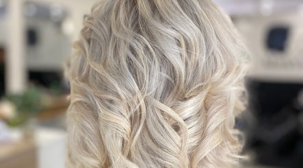 Blonde wavy hairstyle at Me and You Hair Salon in Corrimal, New South Wales, AU, showcasing fine texture.